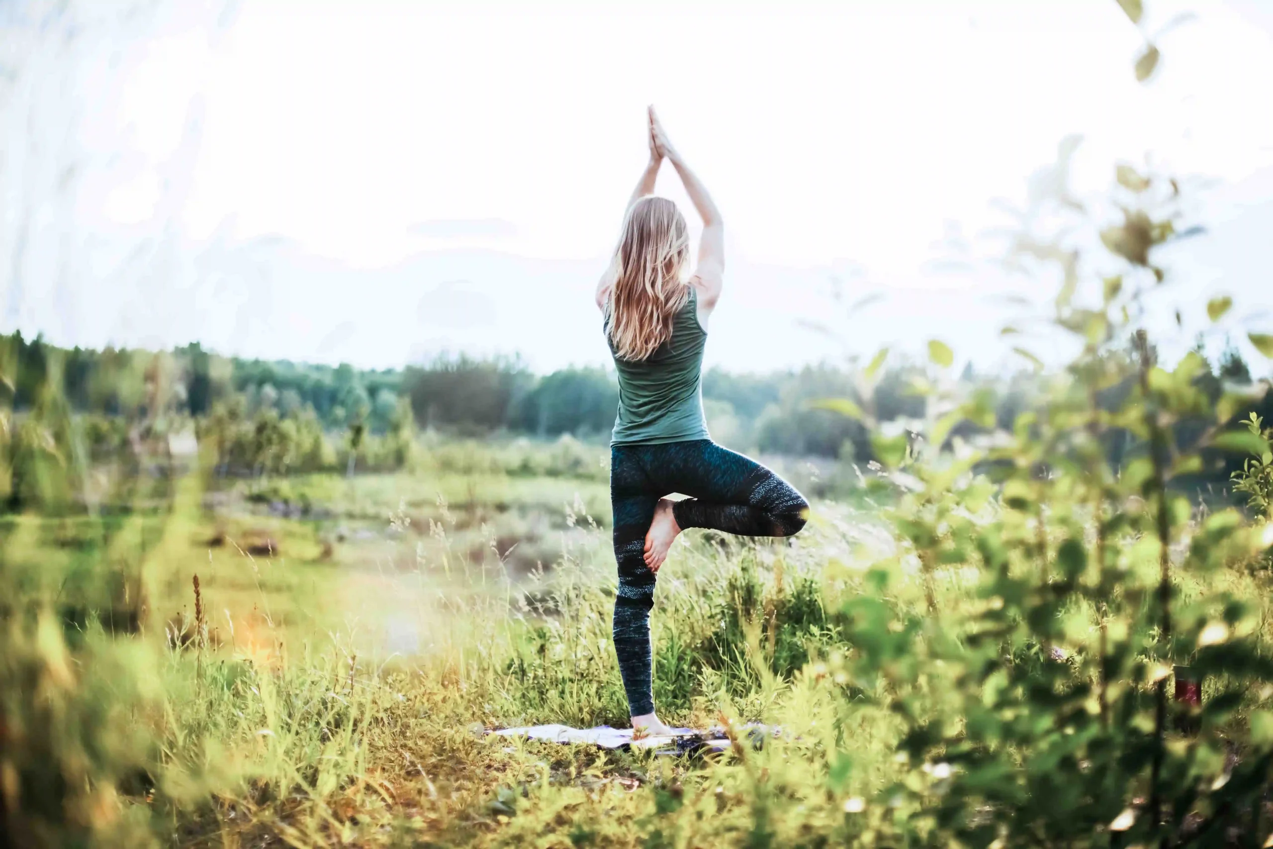 Woman practicing yoga at Manso Waters Lodge in Bariloche, Patagonia, one of the activities included in our all-inclusive lodge packages.